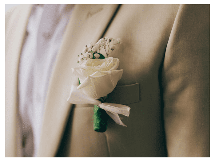 A close up of the flower on a suit